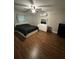 Bedroom featuring modern décor, wood floors, ceiling fan, and natural light at 8788 Se 88Th Pl, Ocala, FL 34472