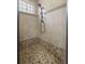 Modern bathroom featuring tiled shower with updated shower head and clear glass door at 3907 Se 10Th Ave, Ocala, FL 34480