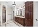 Bathroom featuring dual sinks, and a spacious shower with glass door at 3907 Se 10Th Ave, Ocala, FL 34480