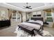 The main bedroom has tray ceilings, plantation shutters, and a seating area at 3907 Se 10Th Ave, Ocala, FL 34480