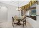 Dining nook with chandelier lighting and a view of the backyard pool area at 3907 Se 10Th Ave, Ocala, FL 34480