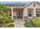 Beautiful front door of home featuring glass accents and stone accents, plus manicured landscaping at 3907 Se 10Th Ave, Ocala, FL 34480