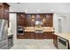 Gourmet kitchen featuring stainless steel appliances, dark wood cabinetry, and granite countertops at 3907 Se 10Th Ave, Ocala, FL 34480
