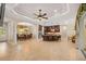 Expansive living space with tile flooring, kitchen views, plus dining and sliding glass doors to the lanai at 3907 Se 10Th Ave, Ocala, FL 34480