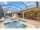 Screened in patio with a pool and spa with water feature, dining table with chairs, and outside seating at 3907 Se 10Th Ave, Ocala, FL 34480