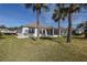 Home exterior with spacious backyard and palm trees at 5520 Nw 26Th Ln, Ocala, FL 34482