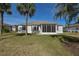 Home exterior view, showcasing large backyard and screened porch at 5520 Nw 26Th Ln, Ocala, FL 34482