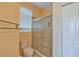Bathroom with tiled shower and linen closet at 5520 Nw 26Th Ln, Ocala, FL 34482
