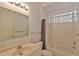 Bathroom with bathtub, shower, and updated vanity at 5520 Nw 26Th Ln, Ocala, FL 34482