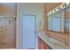 Primary bathroom with double vanity and walk-in shower at 5520 Nw 26Th Ln, Ocala, FL 34482