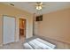 Spacious bedroom with ceiling fan, large closet, and ensuite bathroom at 5520 Nw 26Th Ln, Ocala, FL 34482
