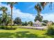Community features lush landscaping and a guardhouse at 5520 Nw 26Th Ln, Ocala, FL 34482