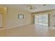 Spacious living room with tile floors and sliding glass doors at 5520 Nw 26Th Ln, Ocala, FL 34482