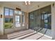 Bright sunroom with glass sliders opening to backyard at 5520 Nw 26Th Ln, Ocala, FL 34482
