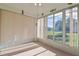 Sunroom with view of backyard and neutral tile flooring at 5520 Nw 26Th Ln, Ocala, FL 34482