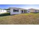 Home with covered patio and grassy backyard at 7781 Sw 59Th Ln, Ocala, FL 34474