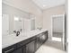 Double vanity bathroom with dark brown cabinets and white countertops at 7781 Sw 59Th Ln, Ocala, FL 34474