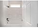 Clean bathroom with a shower/tub combo and white tile at 7781 Sw 59Th Ln, Ocala, FL 34474