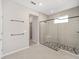 Modern bathroom with a large walk-in shower and hexagon tile at 7781 Sw 59Th Ln, Ocala, FL 34474