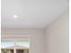 Bright bedroom with window and view of neighborhood at 7781 Sw 59Th Ln, Ocala, FL 34474