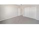 Simple bedroom with grey carpet and double door closet at 7781 Sw 59Th Ln, Ocala, FL 34474