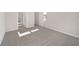 Bright bedroom with grey carpet and two doors at 7781 Sw 59Th Ln, Ocala, FL 34474
