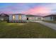 One-story home with two-car garage, landscaping, and driveway at 7781 Sw 59Th Ln, Ocala, FL 34474