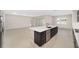 Modern kitchen with island, stainless steel appliances, and granite countertops at 7781 Sw 59Th Ln, Ocala, FL 34474
