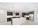 Open concept kitchen with island and stainless steel appliances at 7781 Sw 59Th Ln, Ocala, FL 34474
