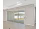 Living room with sliding glass doors leading to backyard patio at 7781 Sw 59Th Ln, Ocala, FL 34474
