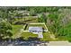 Aerial view of a house with fenced backyard at 14462 Se 28Th Ct, Summerfield, FL 34491