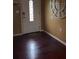 Bright entryway with dark hardwood floors and a large clock at 14788 Sw 39Th Cir, Ocala, FL 34473