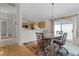 Dining room adjacent to the kitchen with sliding doors and decorative lighting at 1673 Belle Grove Dr, The Villages, FL 32162