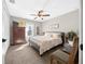 Cozy bedroom featuring a ceiling fan, carpeted floors, and a window that lets in natural light at 17006 Sw 39Th Cir, Ocala, FL 34473