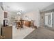 Dining room with wood table, chairs, and cabinet, adjacent to a patio area at 17006 Sw 39Th Cir, Ocala, FL 34473