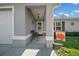 Inviting front porch with bench seating and decorative details at 17006 Sw 39Th Cir, Ocala, FL 34473