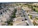 Aerial view of a residential neighborhood with many houses and lush landscaping at 2840 Leicester Ter, The Villages, FL 32162