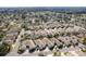 An aerial view of a residential neighborhood, highlighting the community's attractive features at 2840 Leicester Ter, The Villages, FL 32162