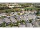 Aerial view of homes near a golf course, highlighting the community's desirable location at 2840 Leicester Ter, The Villages, FL 32162