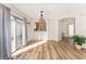 Bright dining room with sliding door to patio and hardwood floors at 2840 Leicester Ter, The Villages, FL 32162