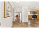 View down hallway from entryway, showing kitchen and living room at 2840 Leicester Ter, The Villages, FL 32162