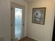 Front entry with glass door and decorative artwork at 2840 Leicester Ter, The Villages, FL 32162