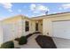 House exterior with walkway leading to the front door and garage at 2840 Leicester Ter, The Villages, FL 32162