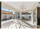 Screened-in Florida room with tile flooring and ceiling fan at 2840 Leicester Ter, The Villages, FL 32162