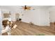 Living room with hardwood floors, ceiling fan and lots of light at 2840 Leicester Ter, The Villages, FL 32162