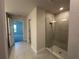 Modern bathroom with a glass-enclosed tiled shower and neutral accents at 4445 Sw 90Th Pl, Ocala, FL 34476