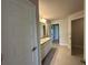 Bathroom featuring double sink vanity, ceramic tile floor, and neutral paint at 4445 Sw 90Th Pl, Ocala, FL 34476