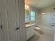 Bathroom featuring modern vanity, toilet, and shower-tub combo at 4445 Sw 90Th Pl, Ocala, FL 34476