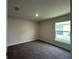 Bedroom featuring carpet floors, neutral paint and a window at 4445 Sw 90Th Pl, Ocala, FL 34476