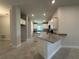 Modern kitchen featuring granite countertops, white cabinetry, and stainless steel appliances at 4445 Sw 90Th Pl, Ocala, FL 34476
